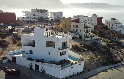 Contemporary seaside villa in Imsouane with spacious terraces, ocean views, and modern architecture, perfect for a relaxing coastal getaway.