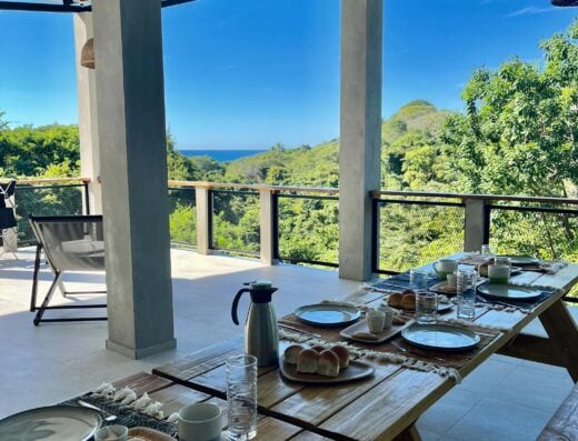 Spacious outdoor dining area at Shalpabay house near K61 and K59, featuring a beautiful mountain landscape and ocean view, perfect for relaxing meals and enjoying nature.