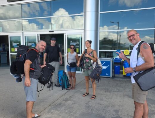 Travelers arriving at airport for monkey-themed tours and adventures.
