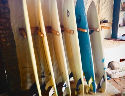 Premium surfboards available for rent, suitable for beginners to advanced surfers, ensuring the perfect ride for every skill level.