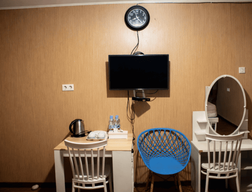 Interior of Fideluna Beach Bungalow with desk and mirror.